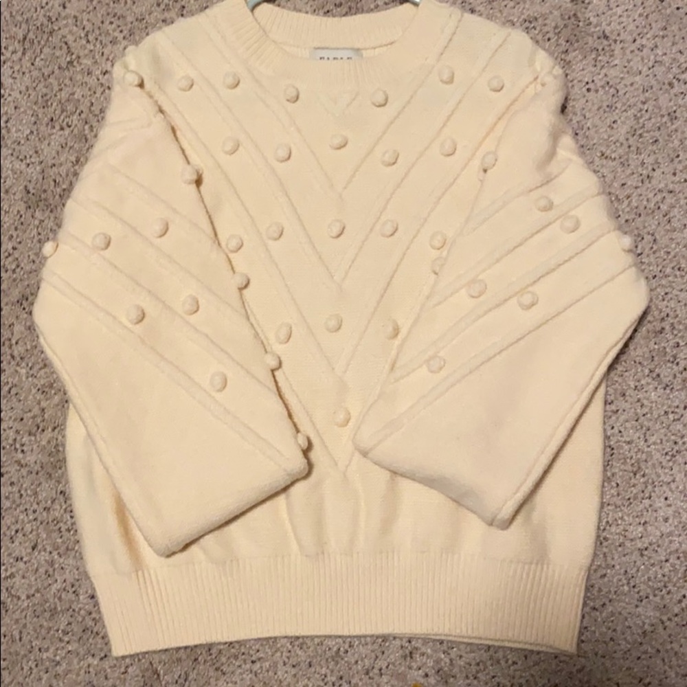 Cream sweater with Pom poms
